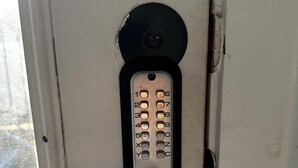 A door with a keypad lock and a metal handle. - 2 BR Haven on Music Row - 8 Min to Downtown - Free Parking - Walkable to Eats -C (Nashville)