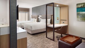 A modern hotel room with a large bed, a desk, and a seating area. - SpringHill Suites by Marriott Arlington TN (Arlington)