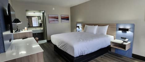 Deluxe Single Room, 1 King Bed, Non Smoking, Refrigerator & Microwave | Desk, laptop workspace, free WiFi, bed sheets