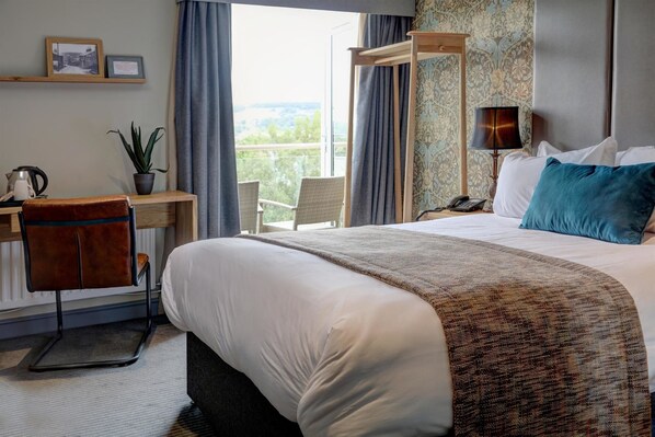 Desk, laptop workspace, iron/ironing board, bed sheets - The New Hobbit Hotel Rooms (Sowerby Bridge)