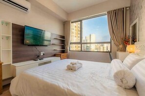 2 habitaciones, tabla de planchar con plancha y cuna de viaje