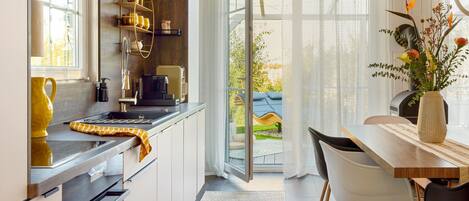 Fridge, stovetop, dishwasher, coffee/tea maker