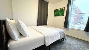 2 dormitorios, tabla de planchar con plancha, wifi y ropa de cama