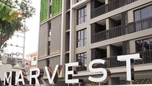 A modern building with a sign that reads "MARVEST HUA HIN".