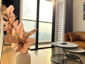 Family Apartment, 3 Bedrooms, City View | Living area | 45-inch Smart TV with digital channels, Netflix, pay movies