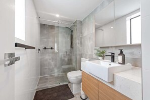 Shower, hair dryer, towels, soap