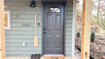 Welcome to a charming home with a front porch and a welcoming entrance.