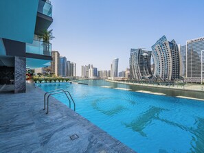 Outdoor pool - Jaw-Dropping Canal Views From This Stylish Condo (Dubai)
