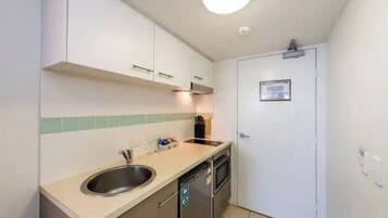 Fridge, microwave, cookware/dishes/utensils