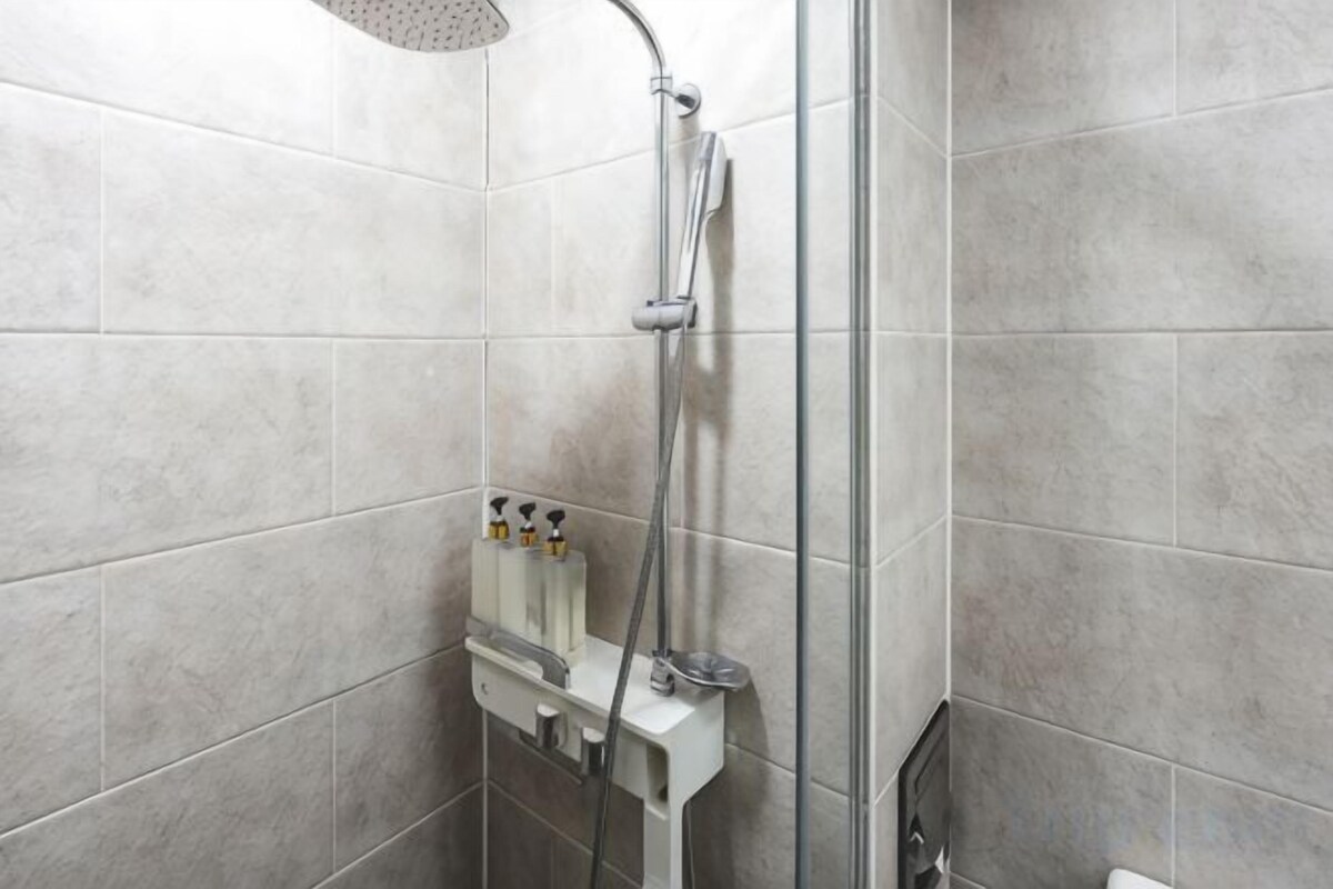 Bathroom | Shower, hair dryer, slippers, towels