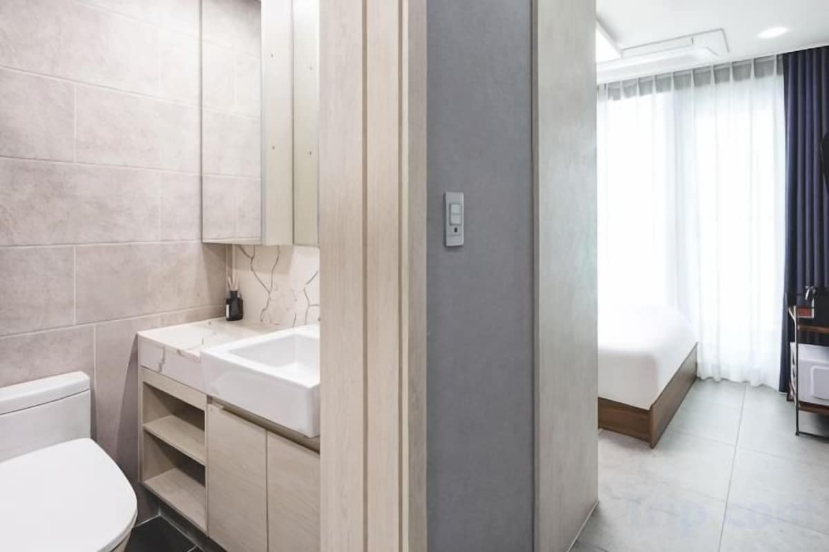 Bathroom | Shower, hair dryer, slippers, towels