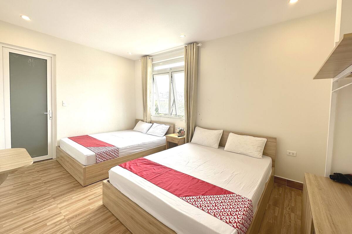 Deluxe Quadruple Room | Desk, laptop workspace, blackout drapes, free WiFi