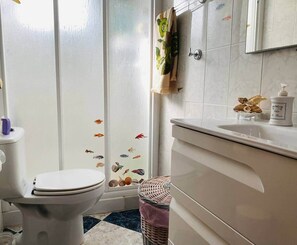 Shower, hair dryer, towels, soap