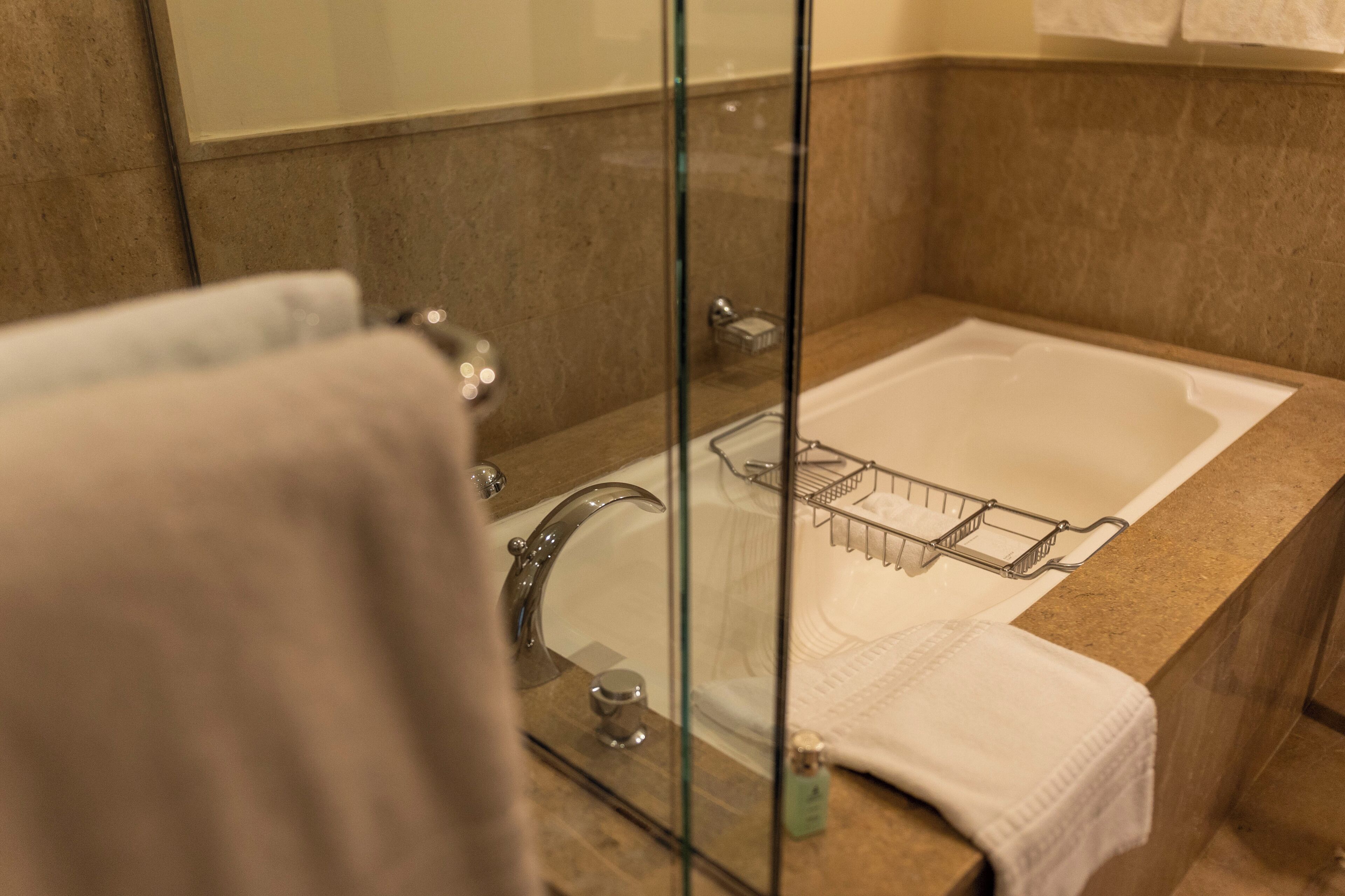 separate bathtub and shower, deep-soaking bathtub, designer toiletries