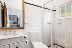 Shower, hair dryer, towels, shampoo