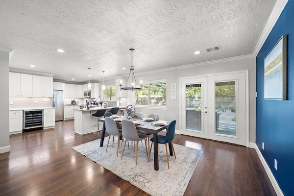 Spacious dining table that sits 6 with full tableware and silverware included.