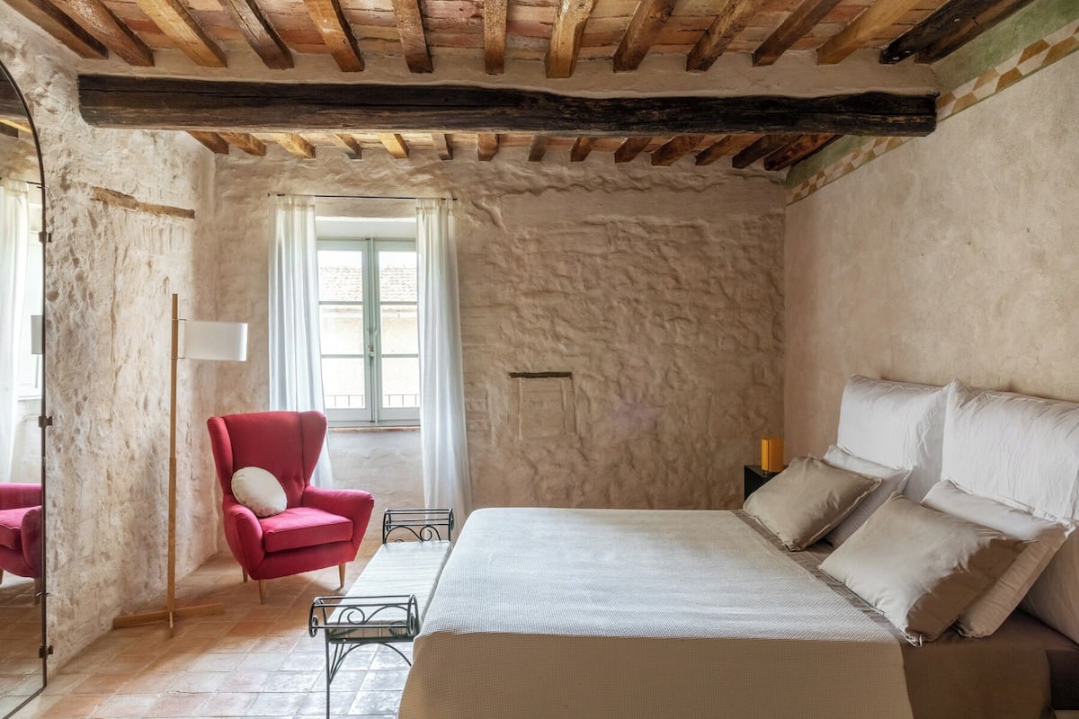 Apartment, 2 Bedrooms (Trilocale) Casa E | Area soggiorno | Caminetto, pavimenti riscaldati