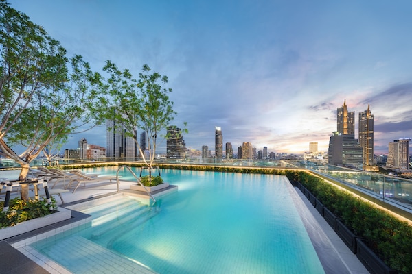 Outdoor pool, open 6:00 AM to 10:00 PM, pool umbrellas, sun loungers