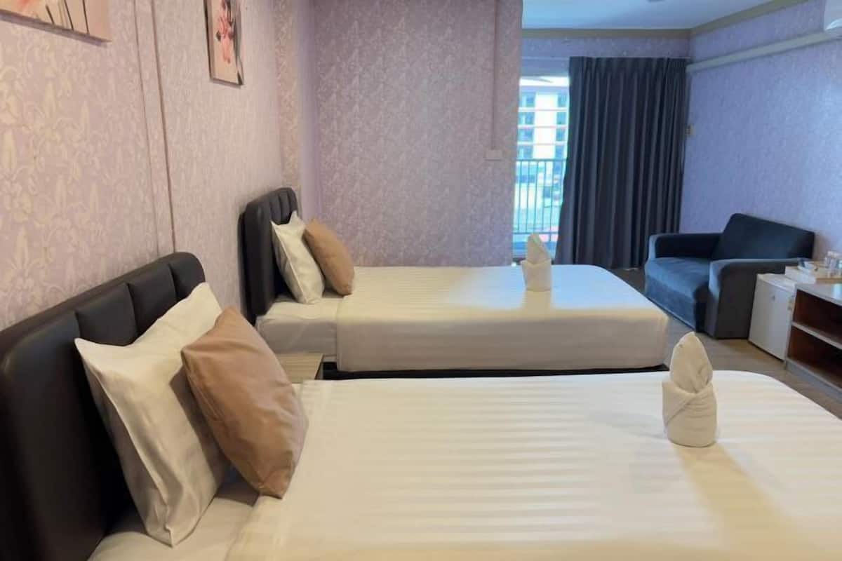 Desk, laptop workspace, bed sheets