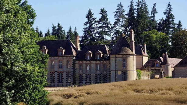 A large, historic building with multiple towers and a prominent central tower. - Château de La Rivière (Pontgouin)