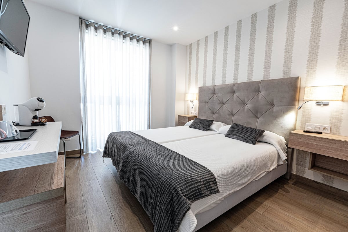 Double Room, City View | Minibar, in-room safe, desk, laptop workspace