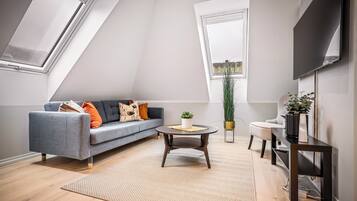 2 bedrooms Apartment (Loft) | Living area | Flat-screen TV