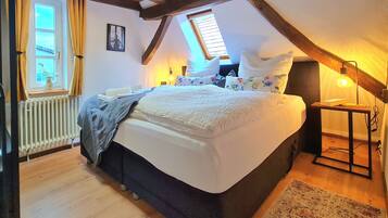 1 bedroom, desk, iron/ironing board, travel crib