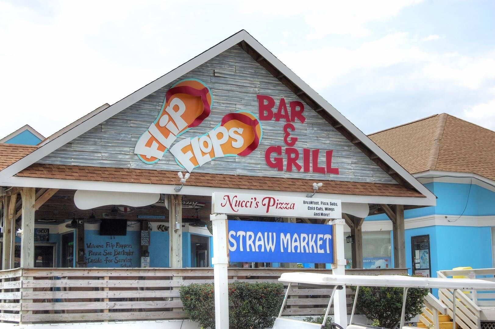 Local dining and shopping await at this charming beachside market, featuring fresh pizza and casual bar fare just steps from the property.