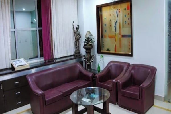 Deluxe Room | Living area | 32-cm LED TV with cable channels