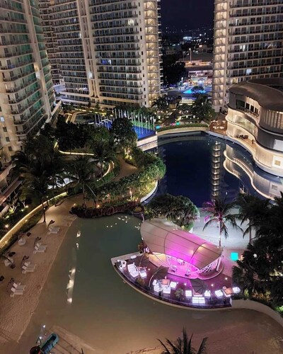 Charming family-sized condo at Azure Urban Resort with a grand wave pool!