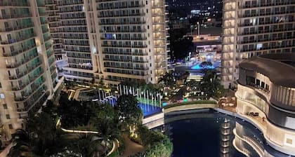 Charming family-sized condo at Azure Urban Resort with a grand wave pool!