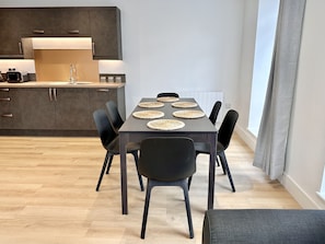Enjoy meals in this dining area with a table for four and comfortable seating.