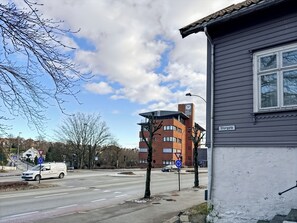 Storgata building features a flat roof and a mix of brick and siding materials.