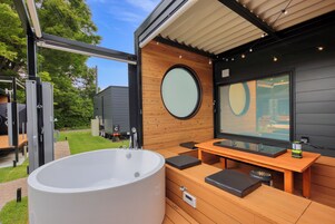 Separate tub and shower, free toiletries, hair dryer, slippers