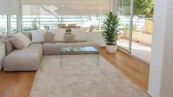 Superior Apartment, Terrace, Tower | Living area | 20-inch TV with satellite channels
