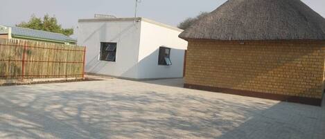 A building with a thatched roof and a white exterior.