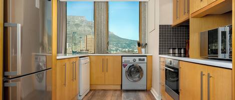 Grand Apartment | Private kitchen | Full-sized fridge, microwave, oven, stovetop