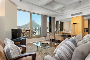 Grand Apartment | Living area | 50-inch flat-screen TV with cable channels, Netflix, streaming services - Cartwrights Corner 1403 (Cape Town)