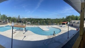 A pool area with a wooden deck, a gazebo, and a fenced area. - Poconos Chalet Newly Renovated, Great Location 3 Bedroom Home by RedAwning (Tobyhanna)