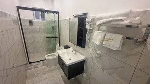 Hair dryer, towels, soap, shampoo