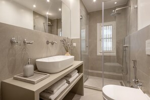 Shower, hair dryer, towels, soap
