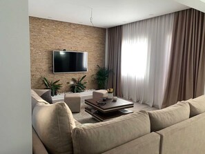 Apartamento, 2 quartos, acessível, piscina particular | Área de estar