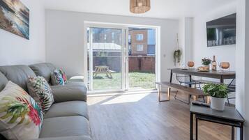 Standard House | Living area | 32-inch Smart TV with cable channels