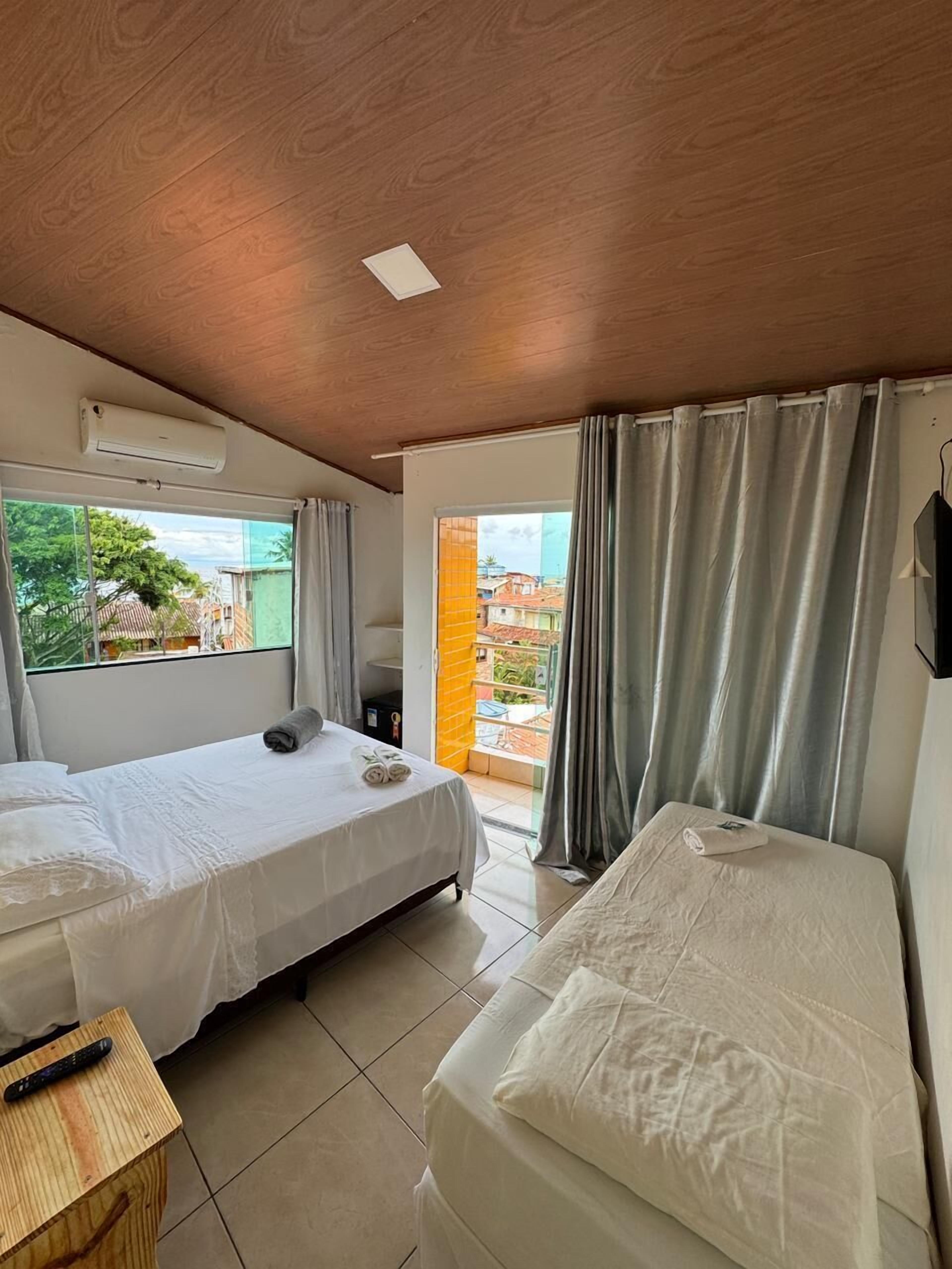 Panoramic Triple Room, Patio, Sea View | Minibar, free WiFi, bed sheets