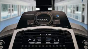 A control panel with a digital display and buttons, a small screen, and a keyboard.