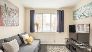 House, Multiple Beds | Living area | Flat-screen TV