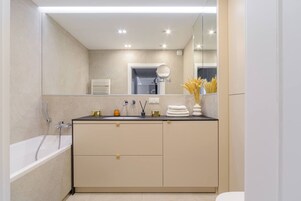 Exclusive Apartment | Bathroom | Bathtub, hair dryer, towels, soap