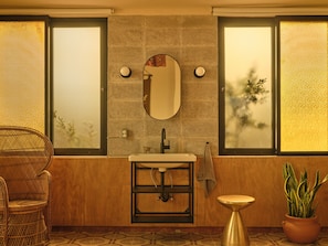 Deluxe Studio | Bathroom | Hair dryer, towels, soap, shampoo