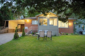 A residential house with a small porch, two chairs, and a mailbox. - A cozy bunglow in Naigara Falls!  (Niagara Falls)