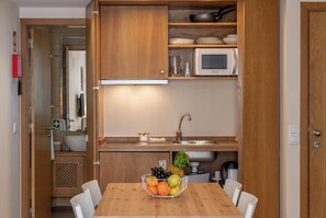 Fridge, microwave, stovetop, coffee/tea maker